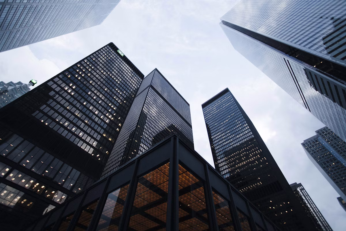 Sleek glass highrise representing corporate structure and assets